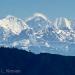 MountEverest(8848m)center,LindarTsubugoHimal(6690m)left&ChobutseHimal(6660m)rightfromMudenearCharikot,Nepal.