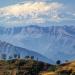 [Himalayanfoothills&cloudshroudedGaneshHimalfromTribhuwayHighwaynearSimBhanjyang,Nepal
